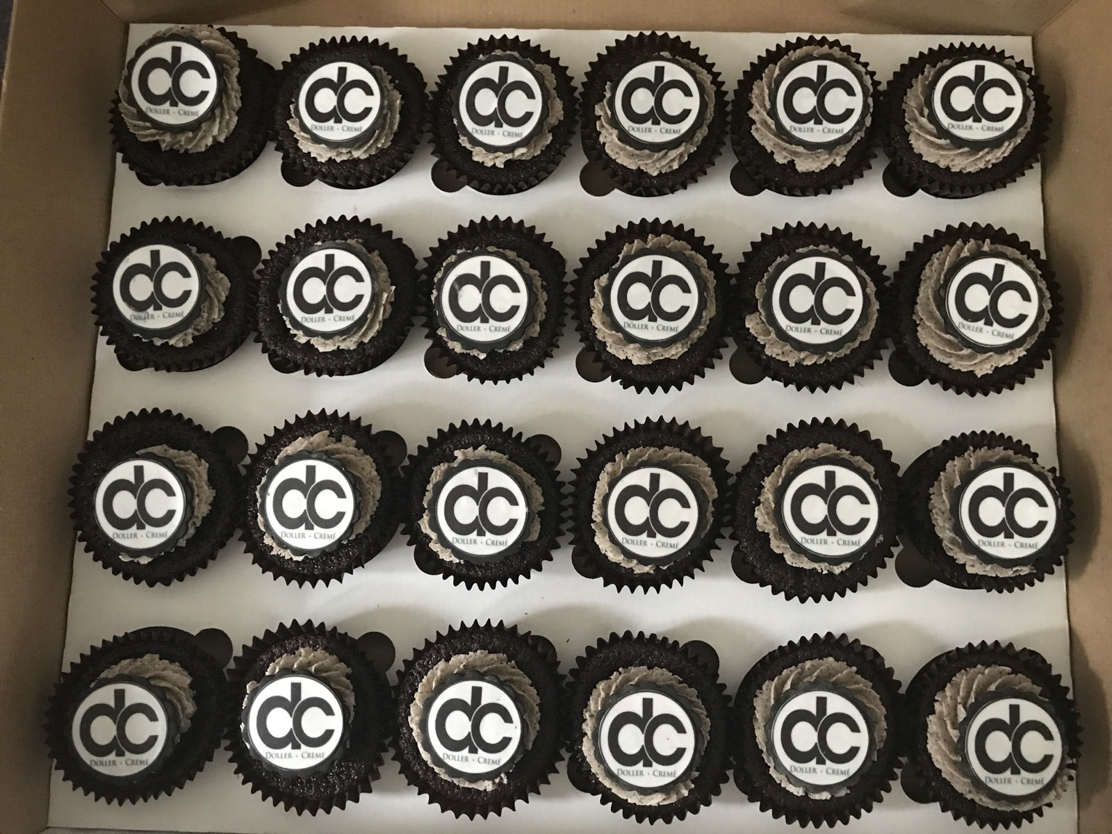 Corporate logo cupcakes in a branded order box