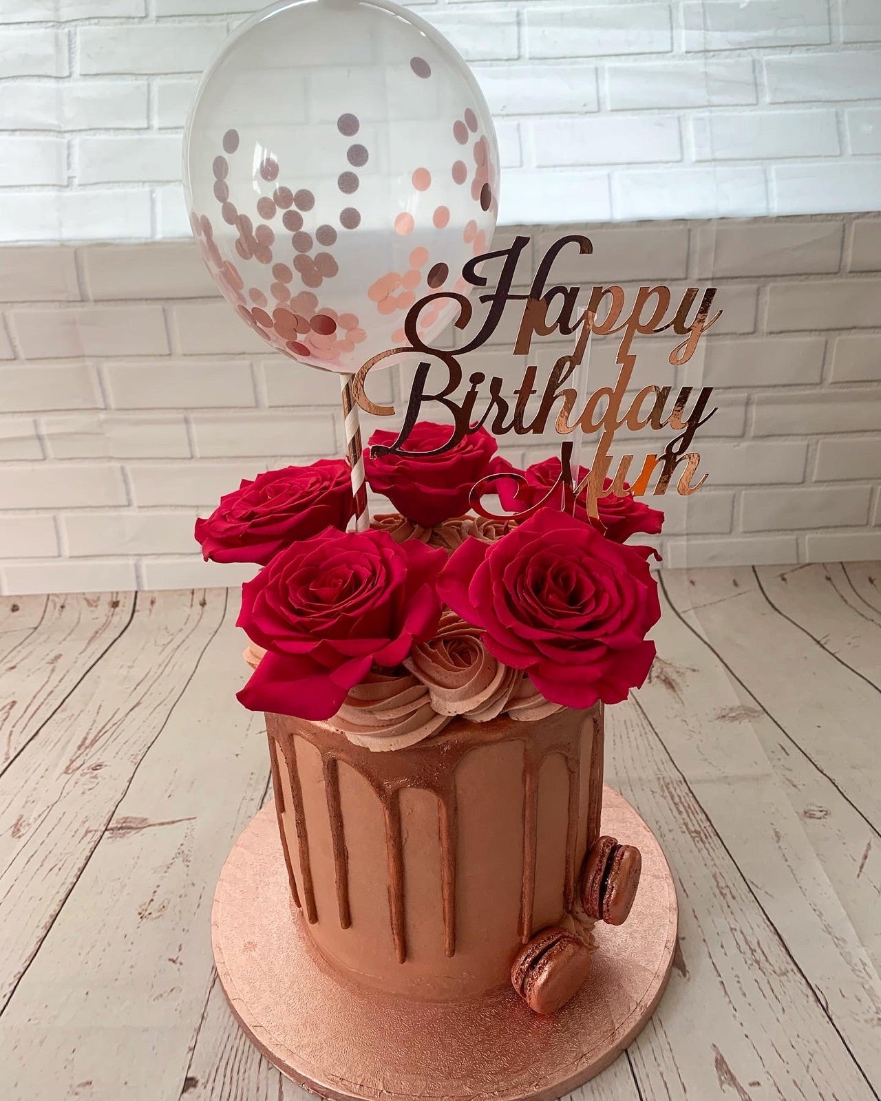 Rose birthday cake with balloon topper and Happy Birthday Mum sign