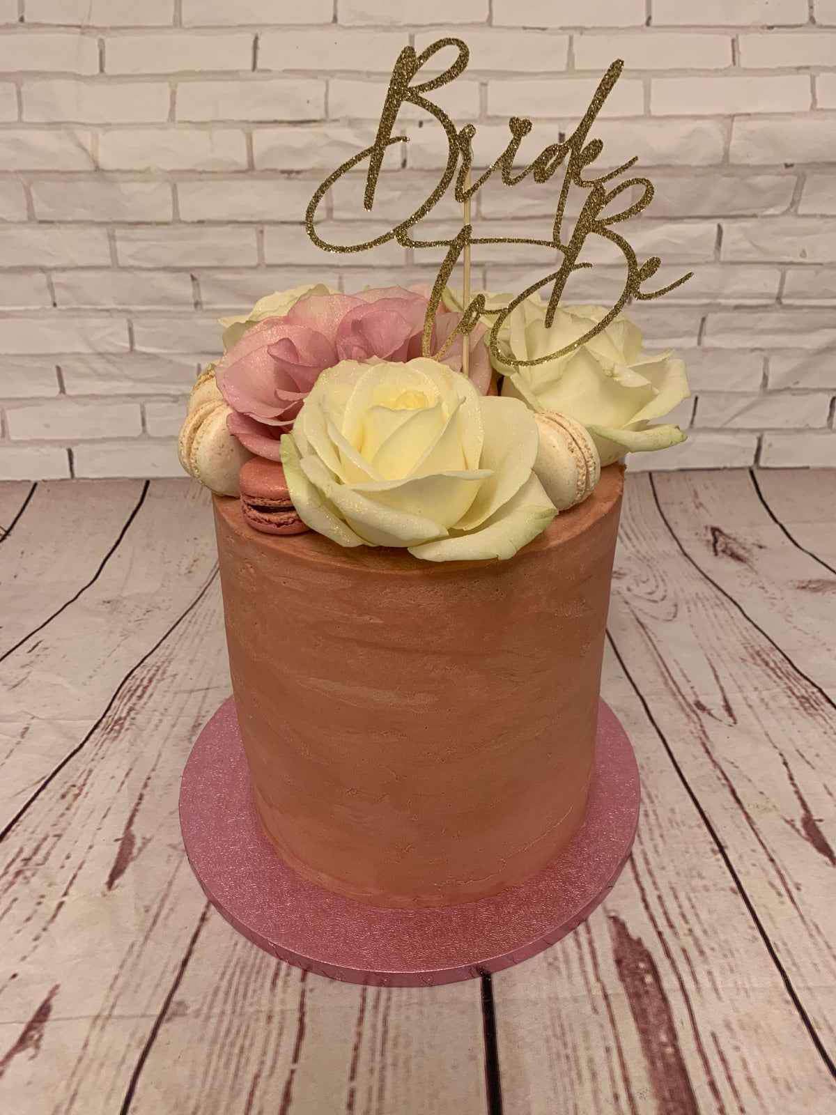 Bride to Be cake with flowers and macarons