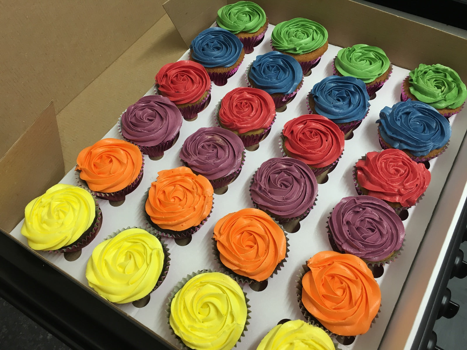 Colourful rose-piped cupcake box