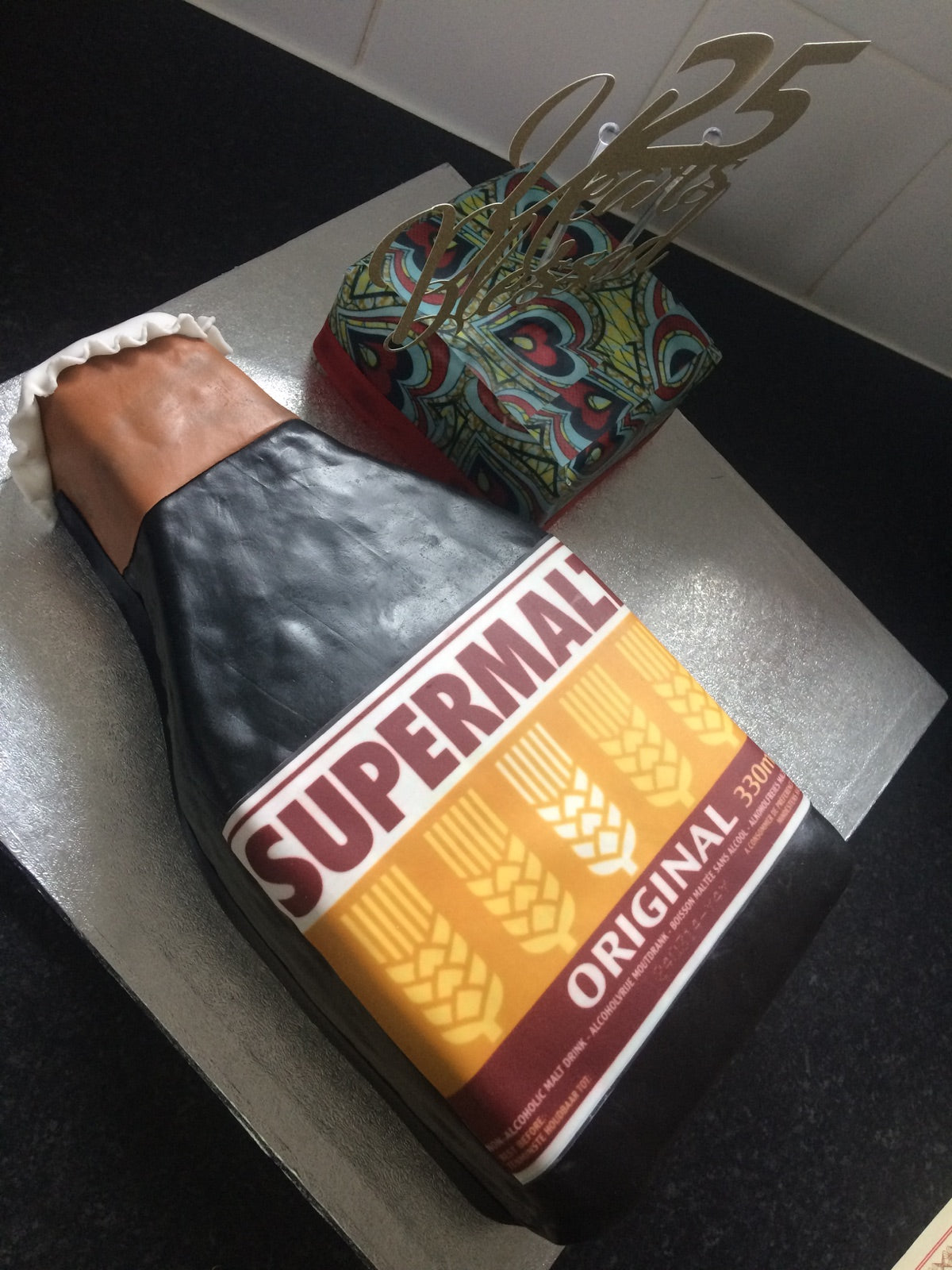 Custom Supermalt bottle and patterned celebration cake