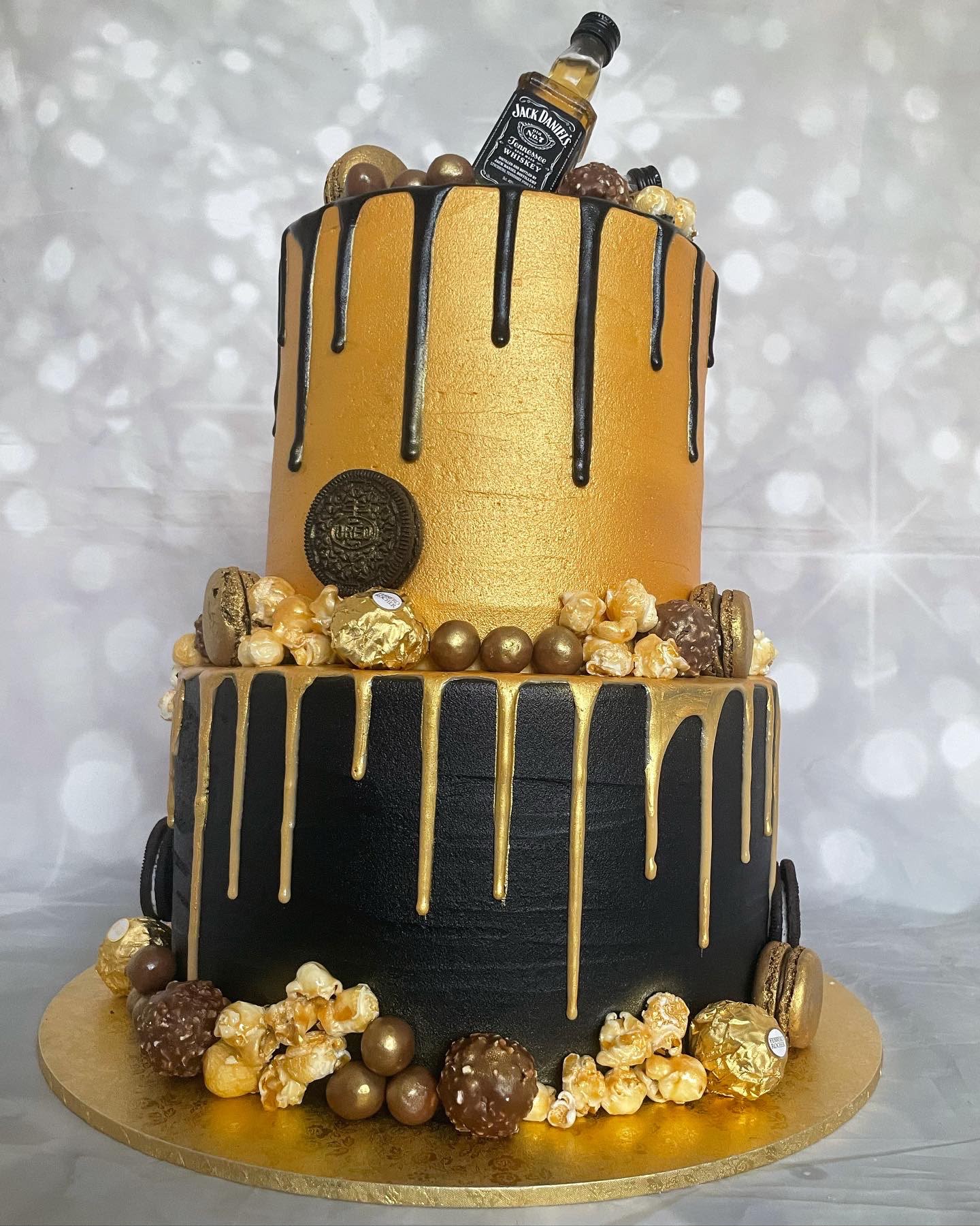 Black and gold tiered wedding cake