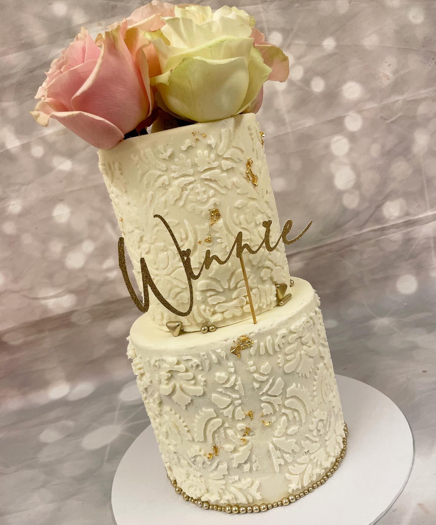 White and gold floral wedding cake