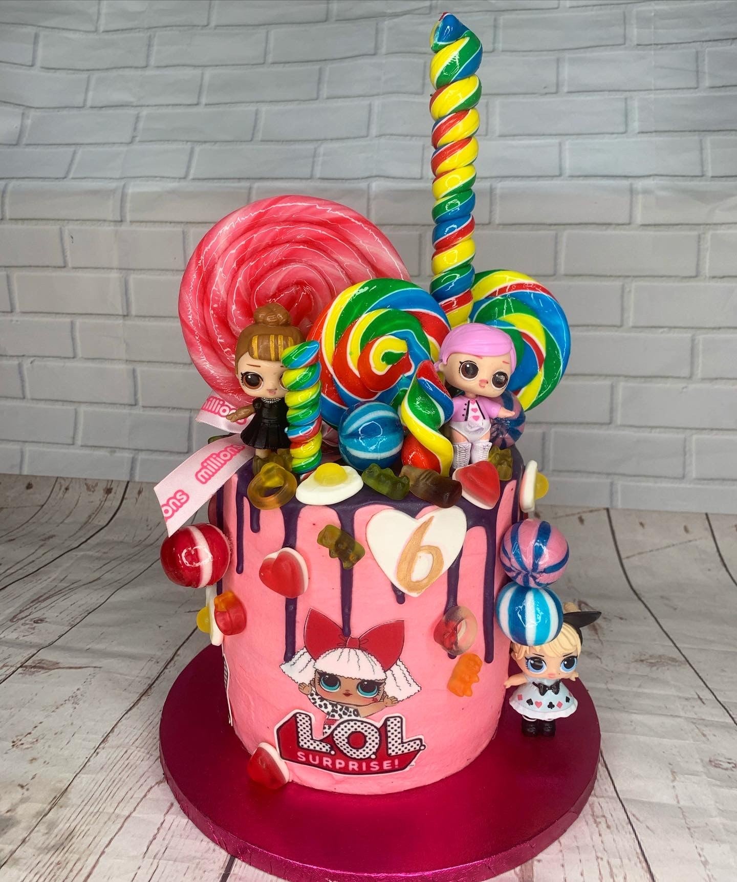 Candy doll celebration cake with colourful decorations