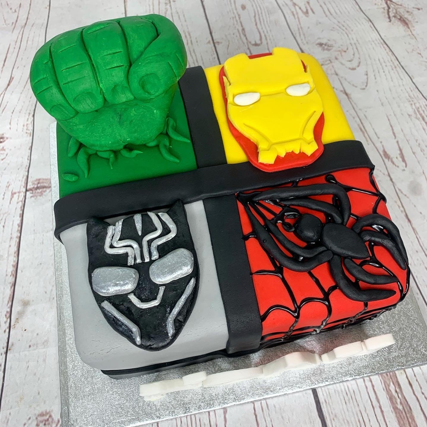 Superhero themed celebration cake